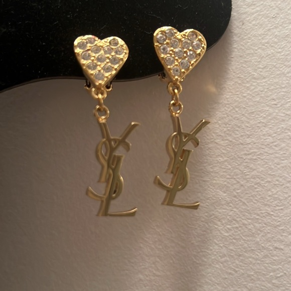 YSL Gold Heart Earrings The heart is full of rhinestones and then you have YSL.